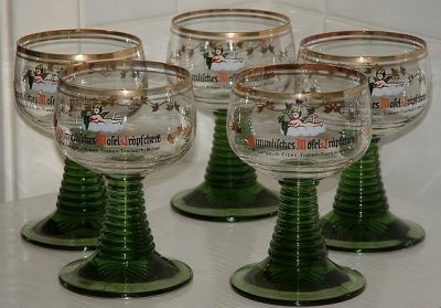 Five medium  Roemers
Olive stems, bowls decorated with gold ivy leaf pattern surrounding Cupid and grapes on a cloud. 105mm high 65mm diameter.
Inscription on bowl reads:
Himmlisches Mosel Tropschen
F.W. Langgurth Erben Traben Trarbach / Mosel
