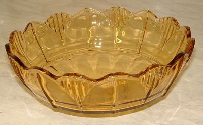 Sowerby amber dish
Patterned amber glass dish with star insert pattern on base, looks like it should have had a stand. Update: I have seen another one of these with small footed dishes in the same pattern as a fruit set, bearing labels for Sowerby Tynesyde Glassware (and the large bowl did not have a base in the set I saw).
Keywords: Sowerby pressed England