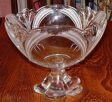 Unknown large patterned bowl with solid foot - view 1
Clear bowl with raised crocus pattern, and frosted leaves, base is solid glass. I think this may be a Walther discontinued design. The foot is the same as a current production item.
