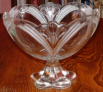 Unknown large patterned bowl with solid foot - view 2
Clear bowl with raised crocus pattern, and frosted leaves, base is solid glass. I think this may be a Walther discontinued design. The foot is the same as a current production item.
