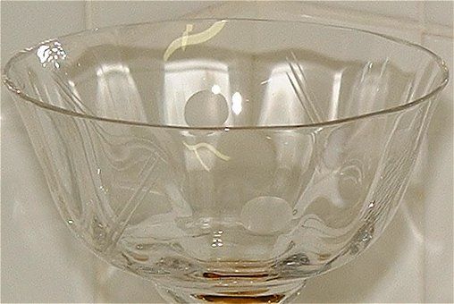 Wide bowl glass - close up
One of a pair of wide bowl glasses with gold stem/foot and clear bowl. Bowl has etched/engraved pattern (see closeup of bowl elsewhere in this album). Unknown maker.
