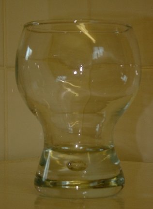 Goblet with air bubble in the base
One of a set of six goblets. Clear glass. Each has an air bubble in the base. Unknown maker.
