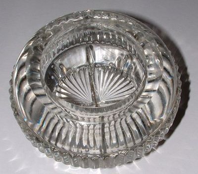 Clear glass salt - top view
No maker's mark. Very heavy. Now known to be Molyneaux Webb pattern 343, thanks to Neil H's fab website: https://sites.google.com/site/molwebbhistory/Home/registered-designs/molineaux-webb-unregistered-pressed-glass/salts
Keywords: pressed