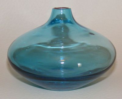 Turquoise vase
Now believed to be an IKEA Salong vase 
http://www.ikea.com/gb/en/catalog/products/20115401/ 
thanks to John Moore on the GMB for the ID! :)
http://www.glassmessages.com/index.php/topic,44824.0.html
