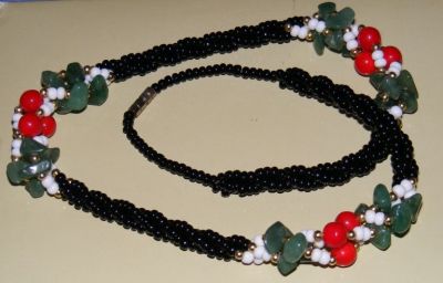 Black, white, red glass beads and green mineral stone chips
