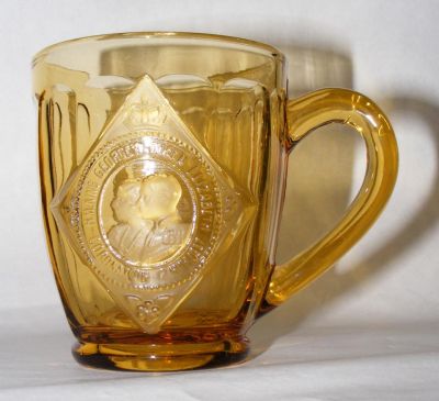 George VI & Elizabeth Coronation tankard dated 1937 in amber glass
Front view
Keywords: Sowerby pressed England coronation commemorative