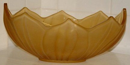 Mustard yellow satin bowl - side view
10" x 6" x 4" high. Satin finish outside, shiny inside. 
Keywords: pressed