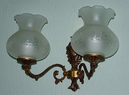 Lampshade - light off
One of a pair of gilded wall light fittings, unknown maker/age. Modern shades, frosted with clear pattern, unknown maker. (Shades bought at Wilkinson's Home and Garden!)
