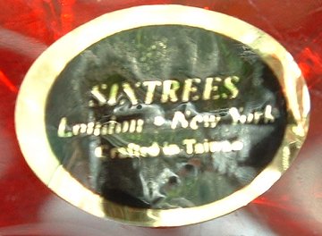 Sixtrees label
Black/gold label on base of red/cased clear bowl.
