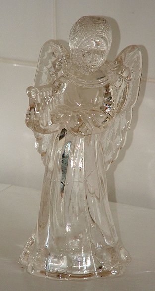 Angel candlestick
Angel holding a harp candlestick, contemporary. Unknown maker.
