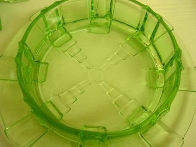 Butter dish with lid and cow handle - base whole - looking into dish 2
Uranium green glass butter dish and lid. Handle of lid is formed by a cow. Unknown maker. Glows brightly even in sunshine!
Keywords: uranium pressed