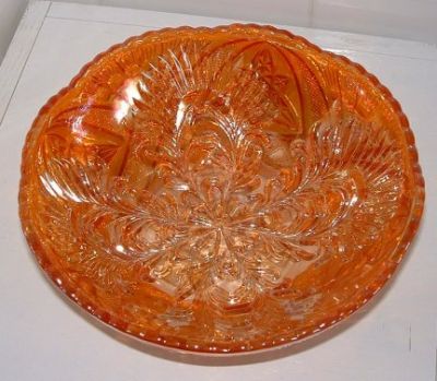 Brockwitz marigold carnival bowl
Brockwitz marigold carnival bowl with a curved star outside and a headdress inside. [Identity confirmed by David Doty's website and Glen Thistlewood on the Glass Message Board]
Keywords: Brockwitz carnival Germany pressed