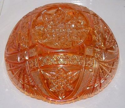 Brockwitz marigold carnival bowl
Brockwitz marigold carnival bowl with a curved star outside and a headdress inside. [Identity confirmed by David Doty's website and Glen Thistlewood on the Glass Message Board]
Keywords: Brockwitz carnival Germany pressed